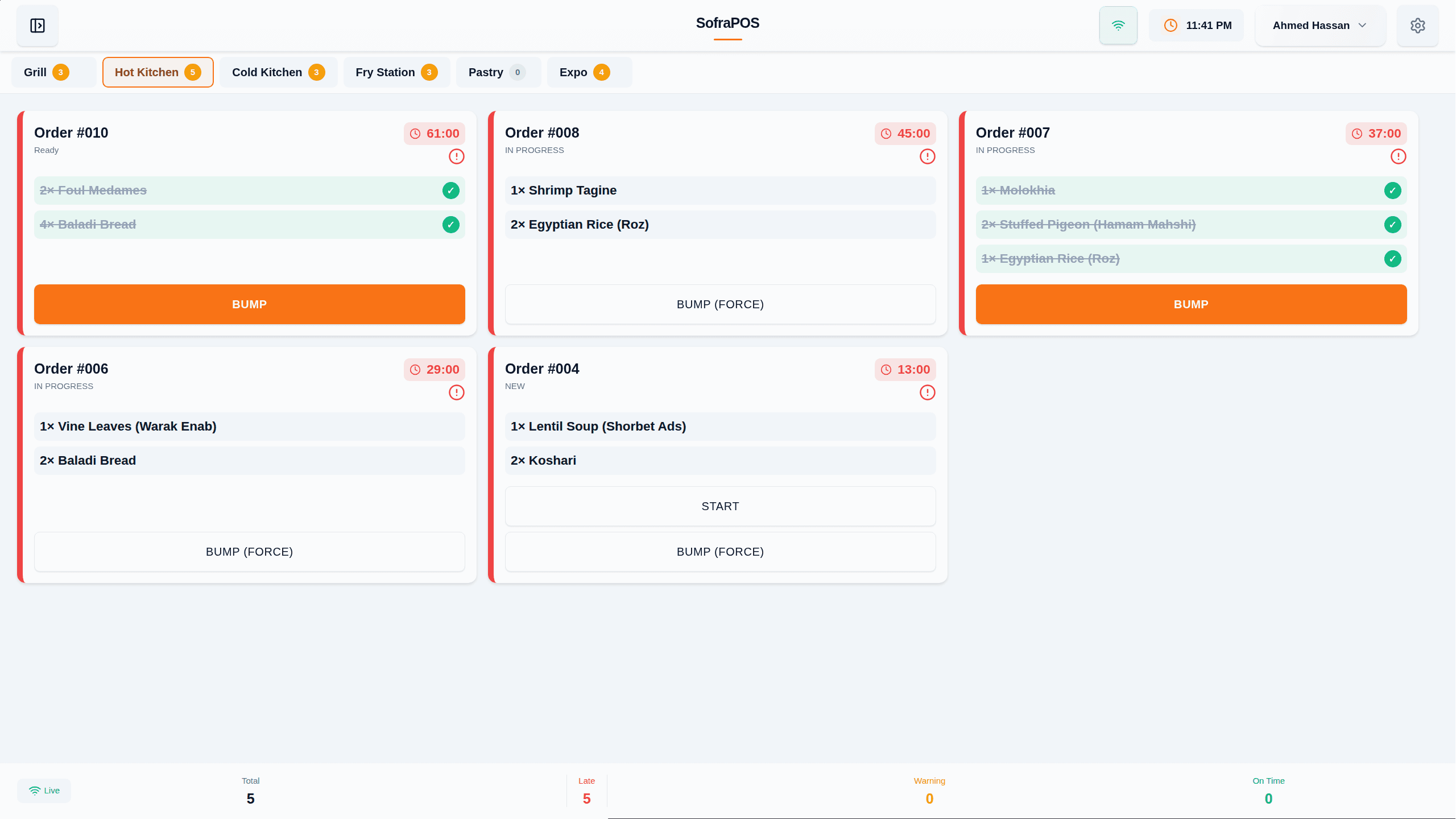The Kitchen Display System: orders routed to stations and bumped in real time.